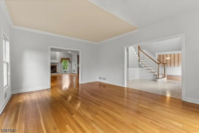 a kitchen with stainless steel appliances granite countertop wooden cabinets a sink dishwasher a stove and a refrigerator