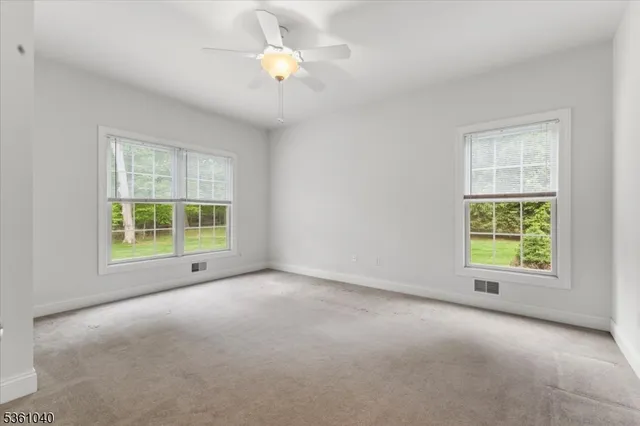 a bathroom with a toilet sink and a mirror