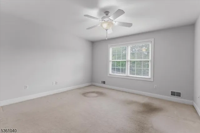a bathroom with a double vanity sink a toilet and a mirror