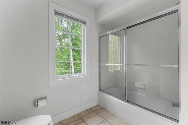 a bathroom with a sink toilet and a shower