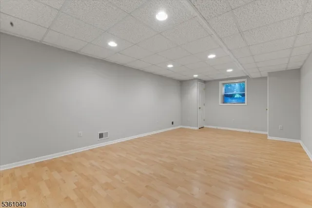 a bathroom with a shower sink and mirror