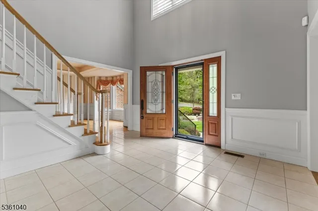 a view of wooden floor and windows in a room