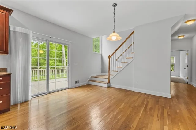 a view of a kitchen with a microwave and a floor to ceiling window