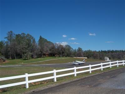 6866 Mosquito Road Placerville, CA 95667 - Photo 2 of 6 a view of a field with trees in the background
