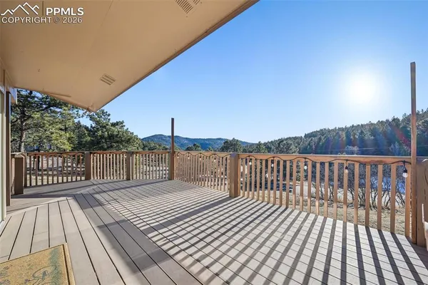 a balcony with wooden floor