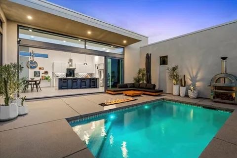 a view of a patio with a table chairs and patio