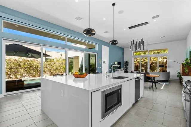 a bed room with a bed and a chandelier