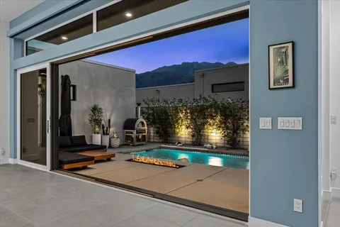 a bathroom with a shower sink and mirror