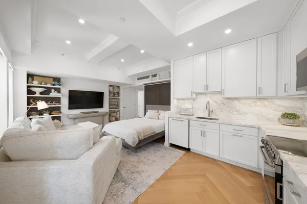 a kitchen with a sink stove and refrigerator