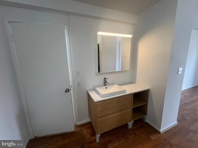 a view of a bathroom sink and a mirror