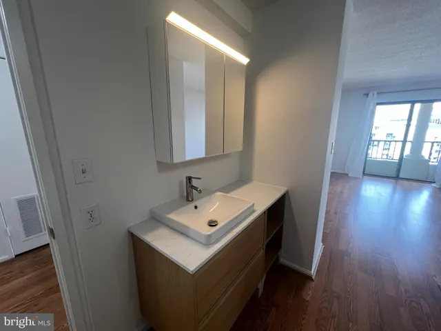 a bathroom with sink and mirror