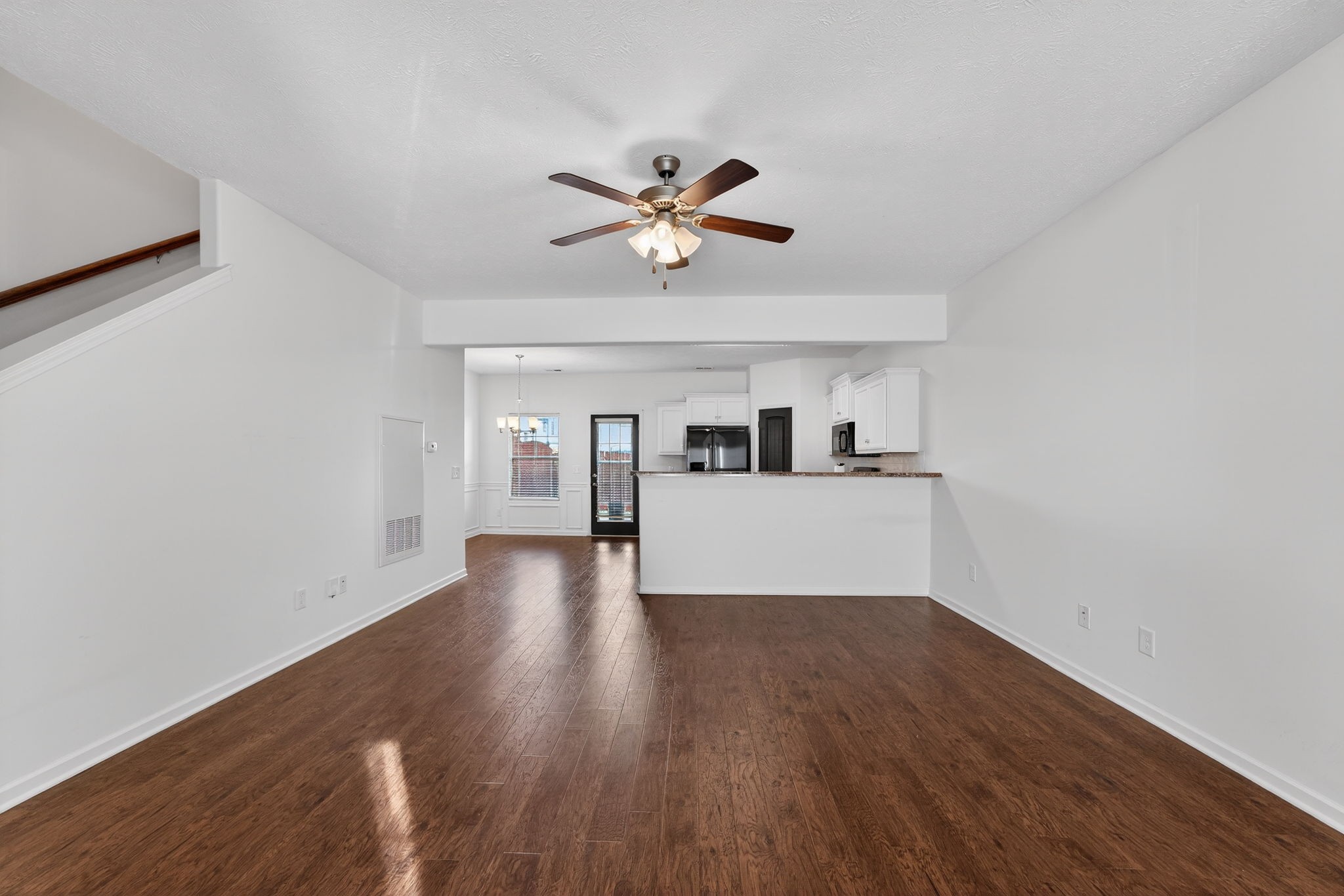 5326 Dan Post Way Murfreesboro, TN 37128 - Photo 3 of 17 a view of a kitchen with wooden floor and a ceiling fan