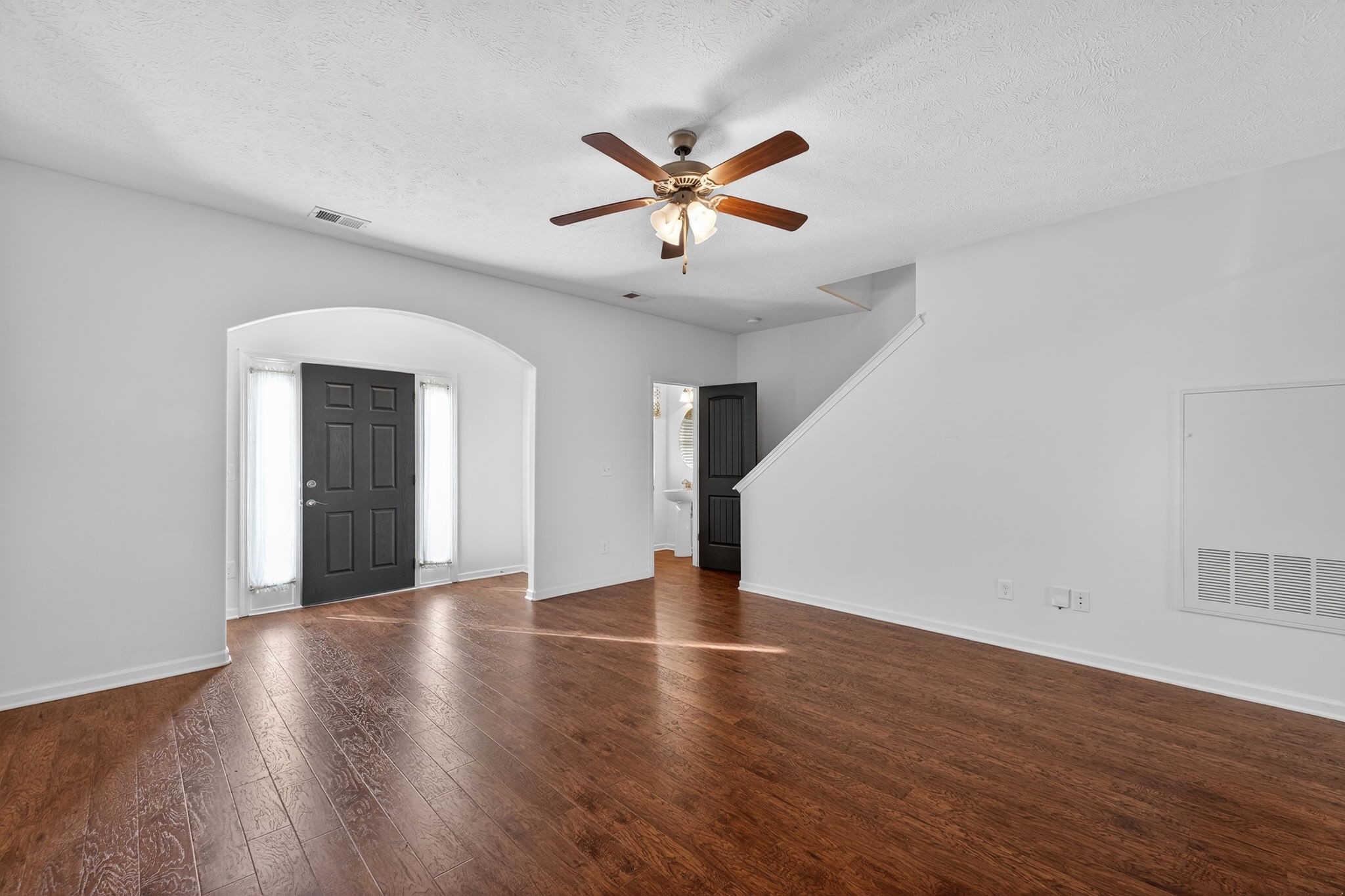 5326 Dan Post Way Murfreesboro, TN 37128 - Photo 5 of 17 a view of an empty room with wooden floor and a ceiling fan