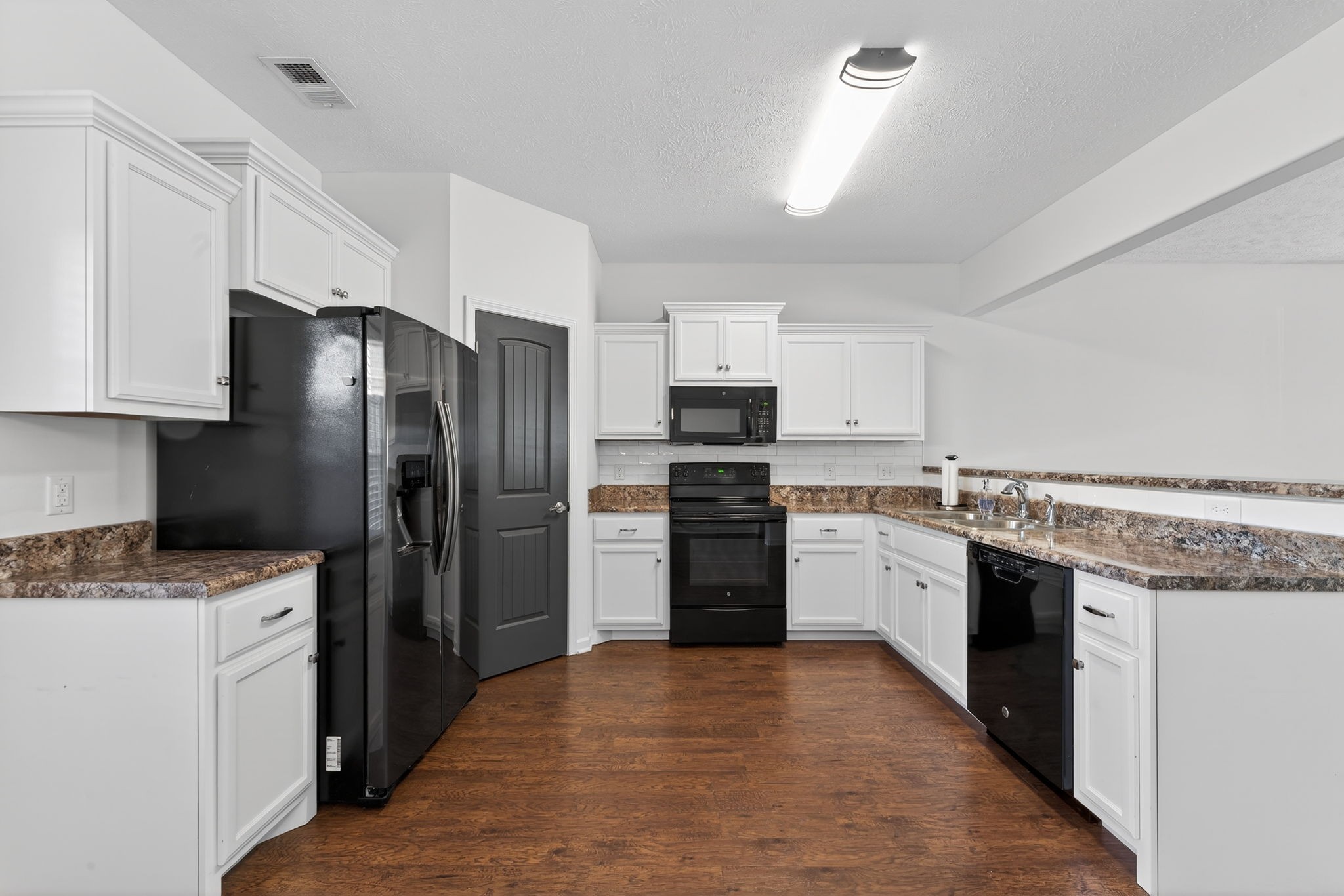 5326 Dan Post Way Murfreesboro, TN 37128 - Photo 8 of 17 a kitchen with stainless steel appliances granite countertop a refrigerator stove top oven and sink