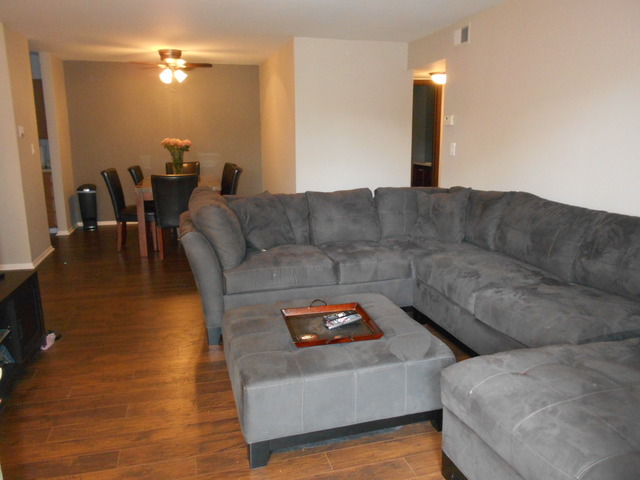 6160 Knoll Wood Road, Unit 206 Willowbrook, IL 60527 - Photo 15 of 17 a living room with furniture and wooden floor