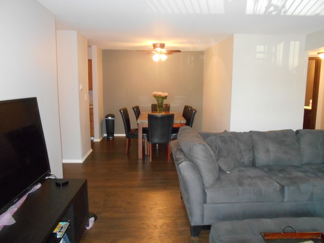 6160 Knoll Wood Road, Unit 206 Willowbrook, IL 60527 - Photo 3 of 17 a living room with furniture and a flat screen tv