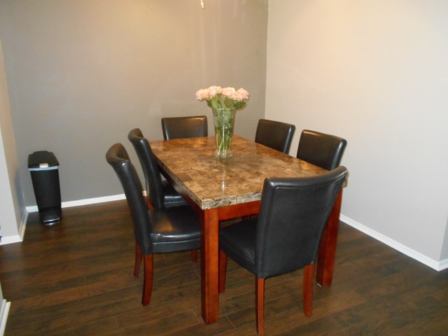 6160 Knoll Wood Road, Unit 206 Willowbrook, IL 60527 - Photo 4 of 17 a dining room with furniture and wooden floor