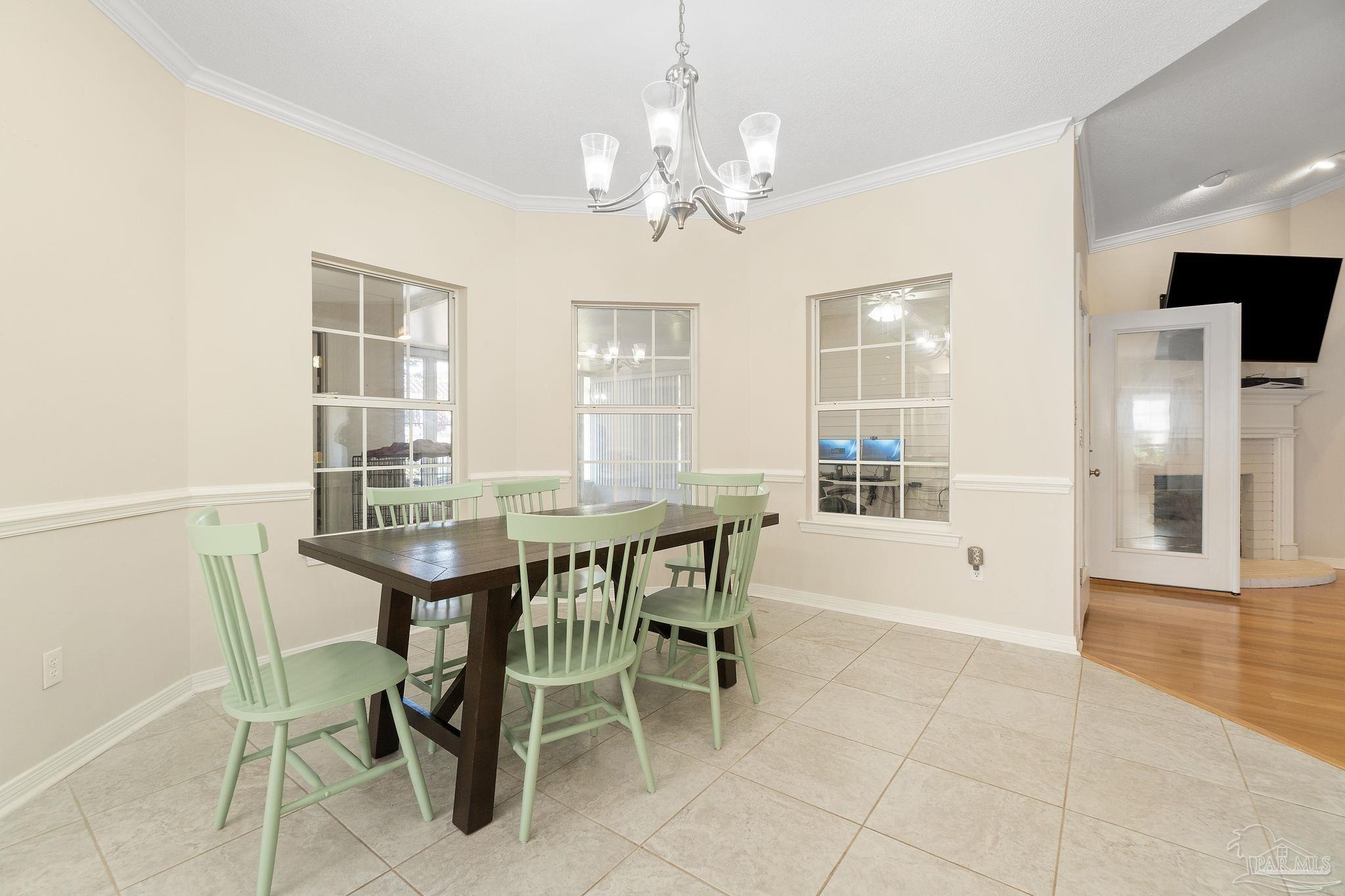1504 Muirfield Road Cantonment, FL 32533 - Photo 12 of 35 a dining room with furniture and window