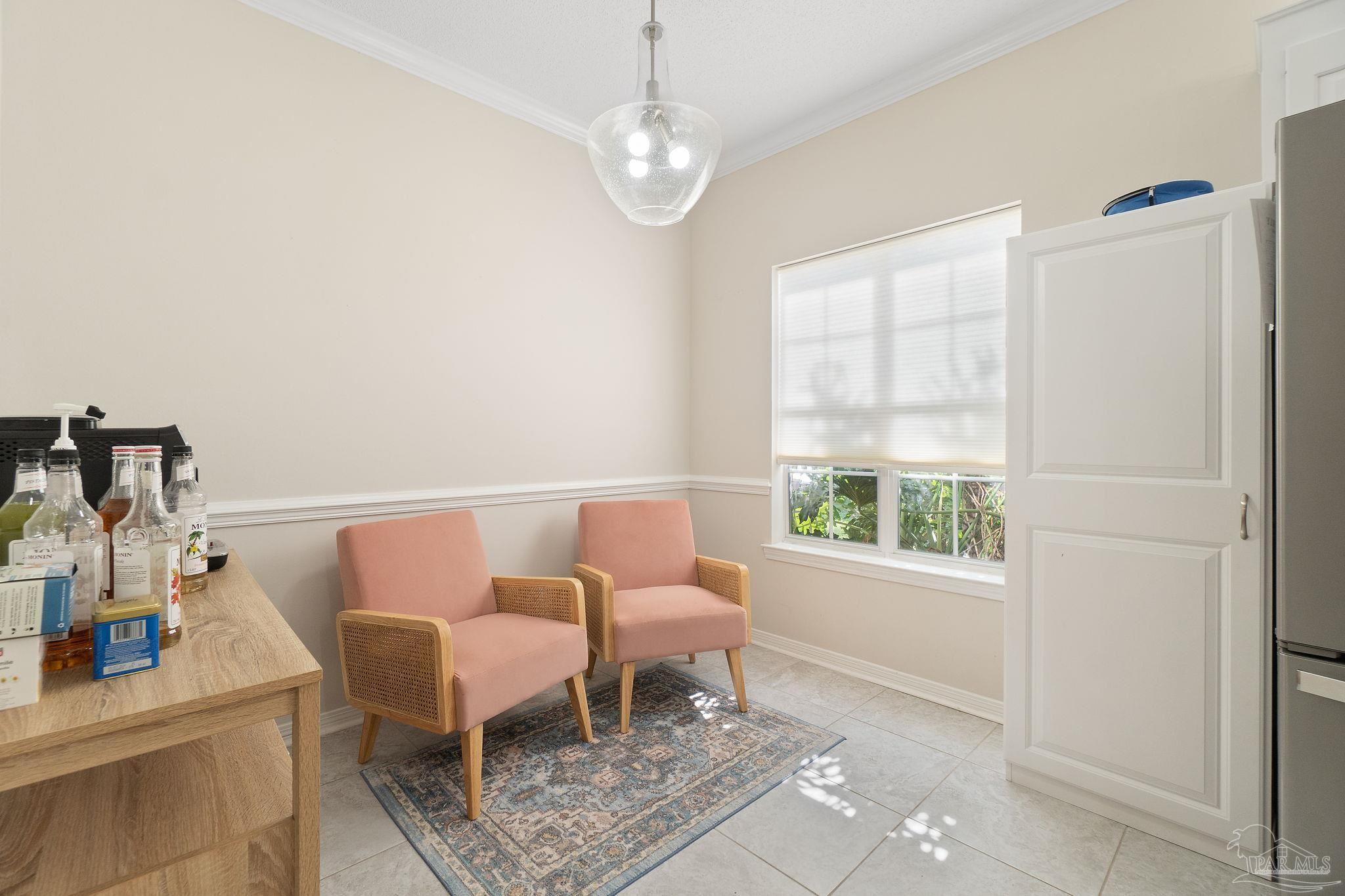 1504 Muirfield Road Cantonment, FL 32533 - Photo 16 of 35 a dining room with furniture and window
