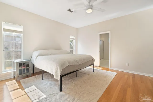 a bedroom with a bed and a table in it