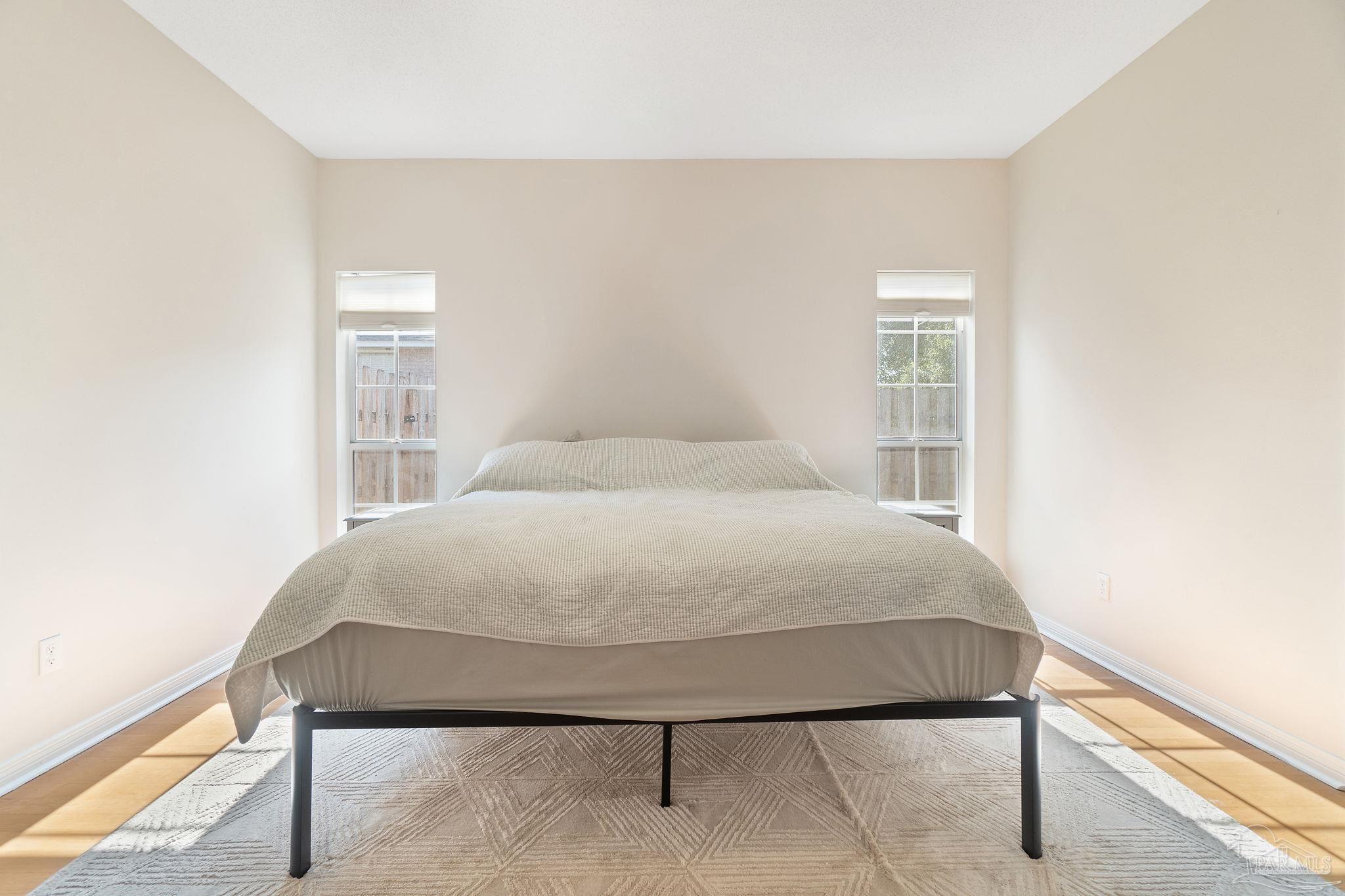 1504 Muirfield Road Cantonment, FL 32533 - Photo 20 of 35 a bedroom with a bed and a window