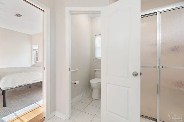 a bathroom with a granite countertop mirror