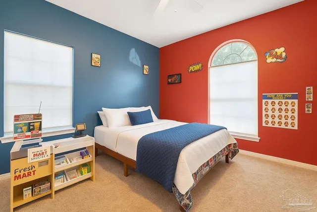 a bedroom with a bed and a window