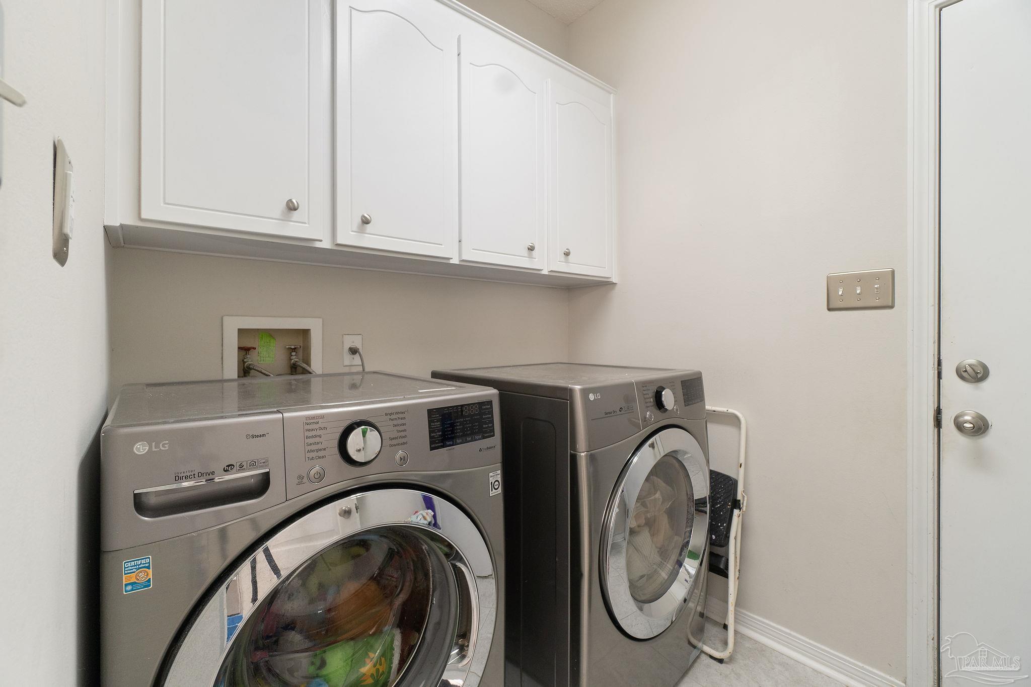 1504 Muirfield Road Cantonment, FL 32533 - Photo 32 of 35 a utility room with dryer and washer