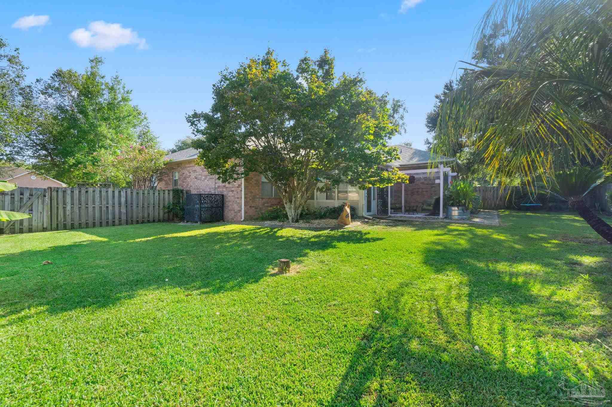 1504 Muirfield Road Cantonment, FL 32533 - Photo 35 of 35 a house view with a garden space