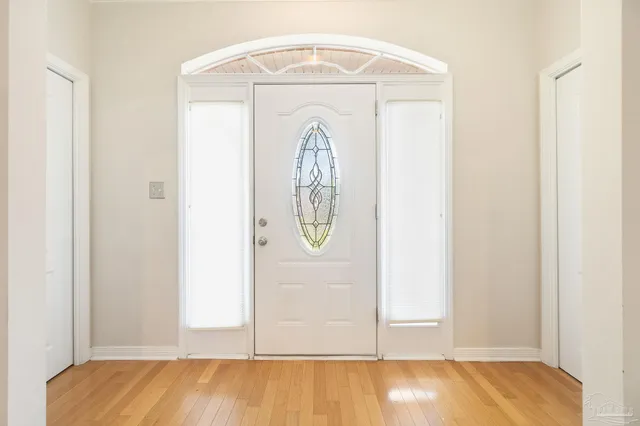 a view of front door with wooden floor