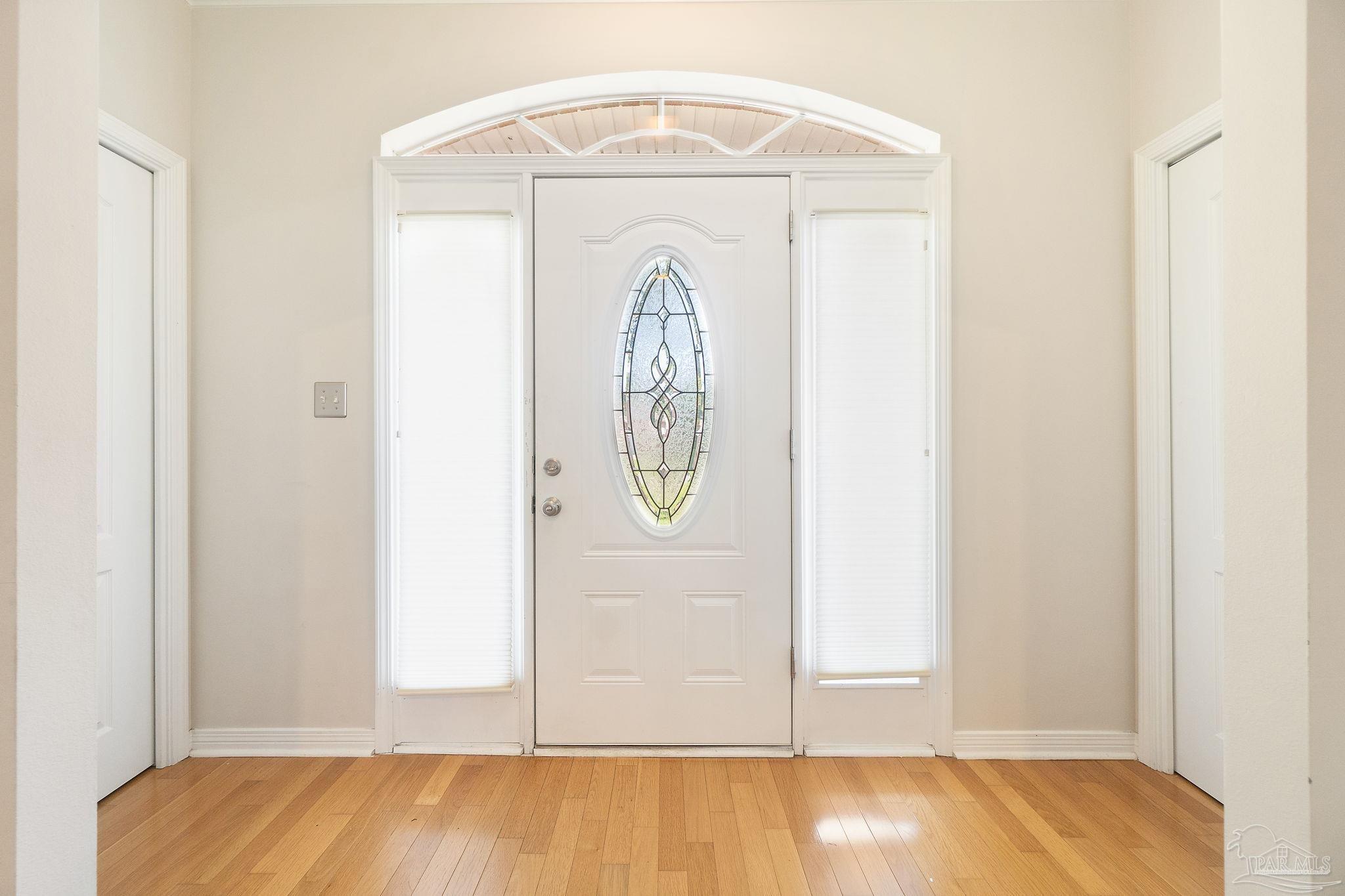 1504 Muirfield Road Cantonment, FL 32533 - Photo 4 of 35 a view of front door with wooden floor