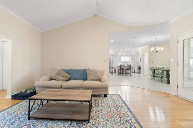a living room with furniture a view of living room and a rug