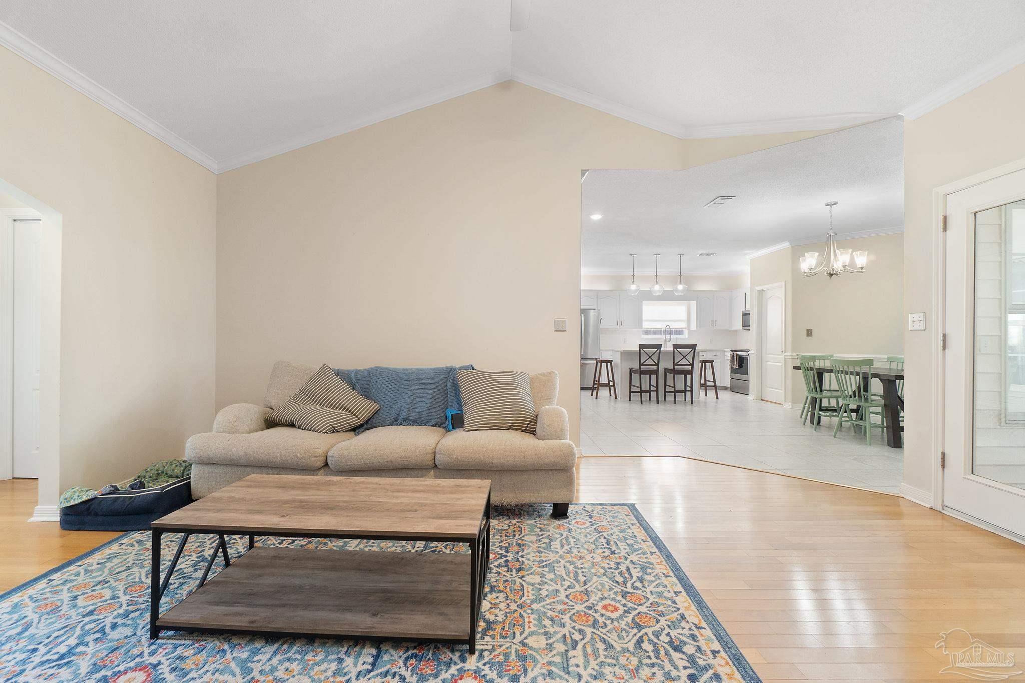 1504 Muirfield Road Cantonment, FL 32533 - Photo 6 of 35 a living room with furniture a view of living room and a rug