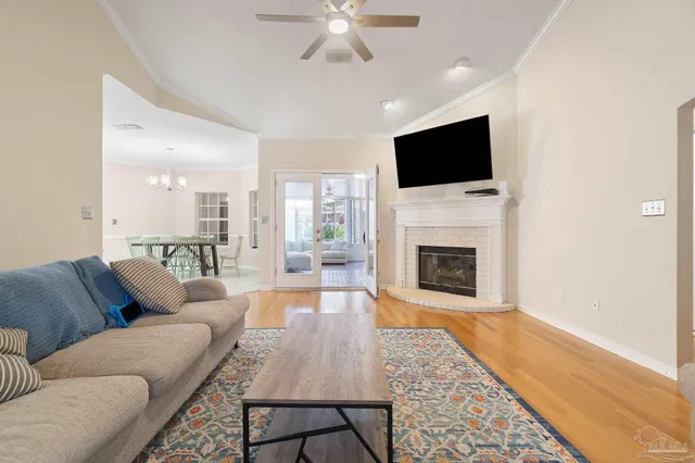 a living room with furniture fireplace and flat screen tv