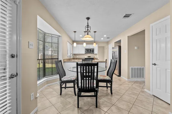 a view of a dining room with furniture