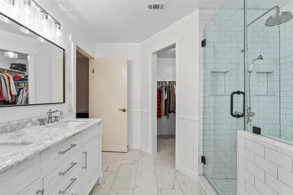 a room with a bed and a chandelier