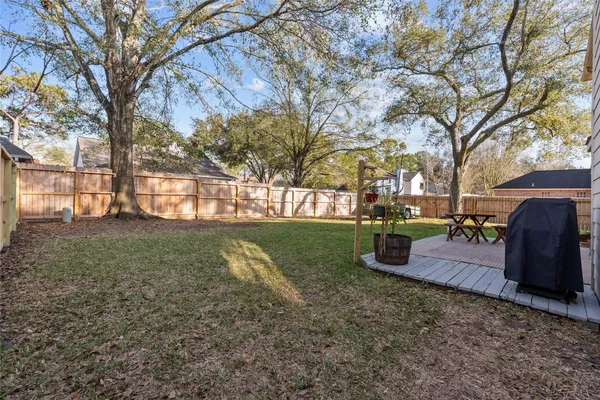 a view of a house with a yard and sitting area
