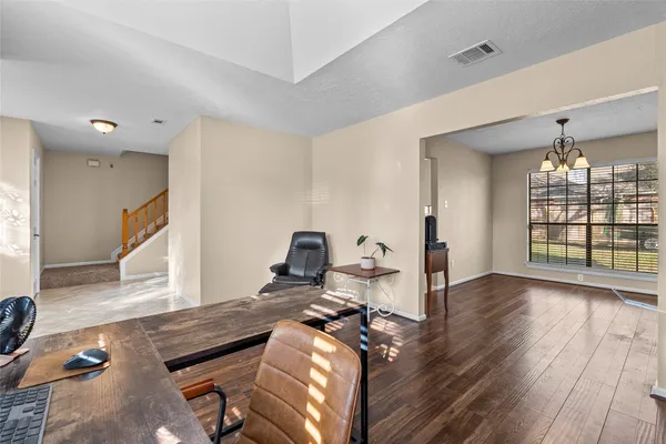 a view of a livingroom with furniture and wooden floor