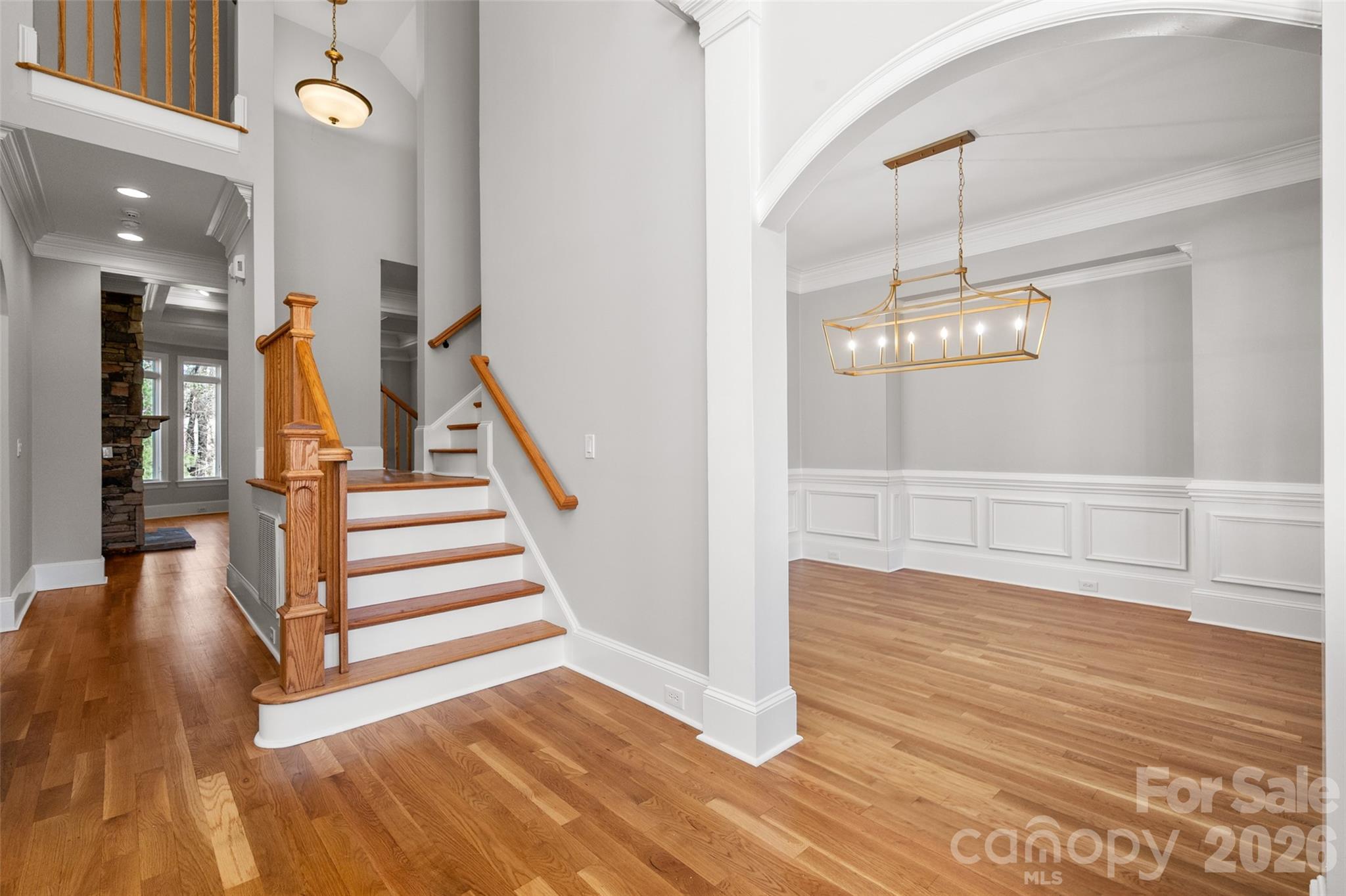 406 Belo Court Fort Mill, SC 29715 - Photo 12 of 46 a view of a room with wooden floor and staircase