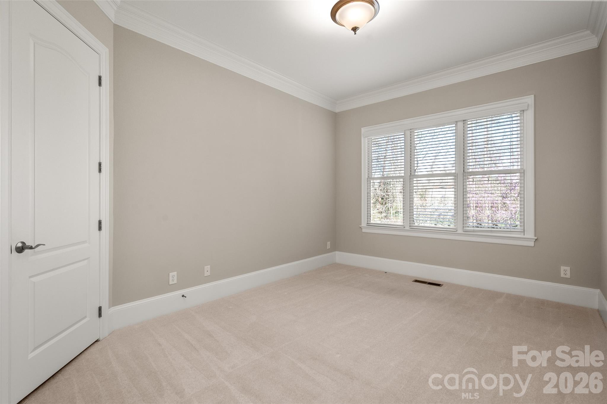 406 Belo Court Fort Mill, SC 29715 - Photo 13 of 46 an empty room with windows