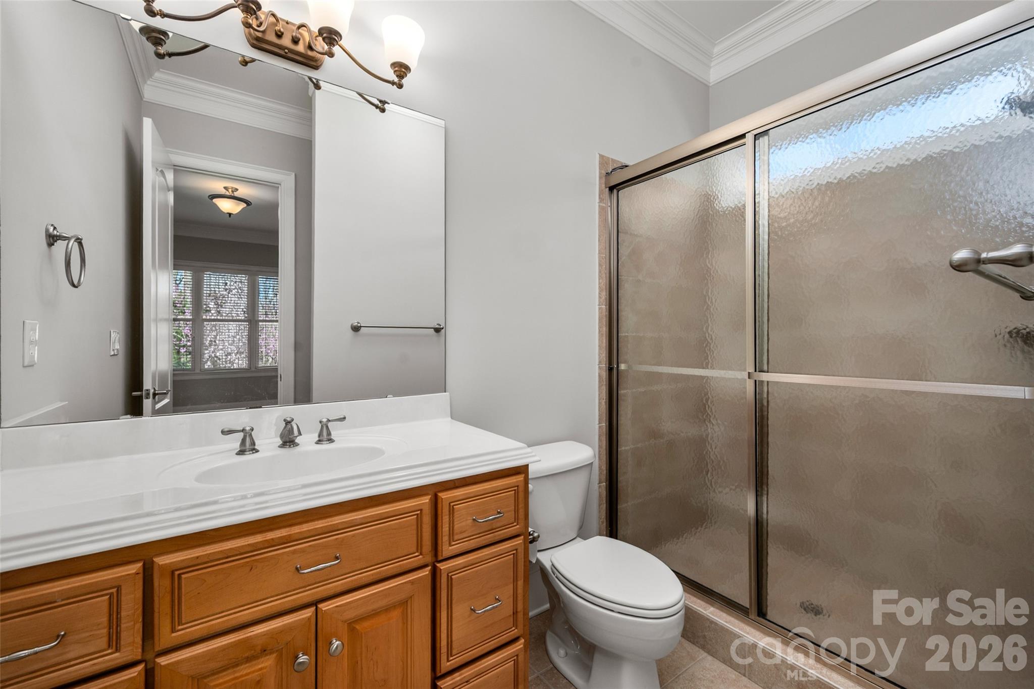 406 Belo Court Fort Mill, SC 29715 - Photo 14 of 46 a bathroom with a granite countertop sink toilet and shower