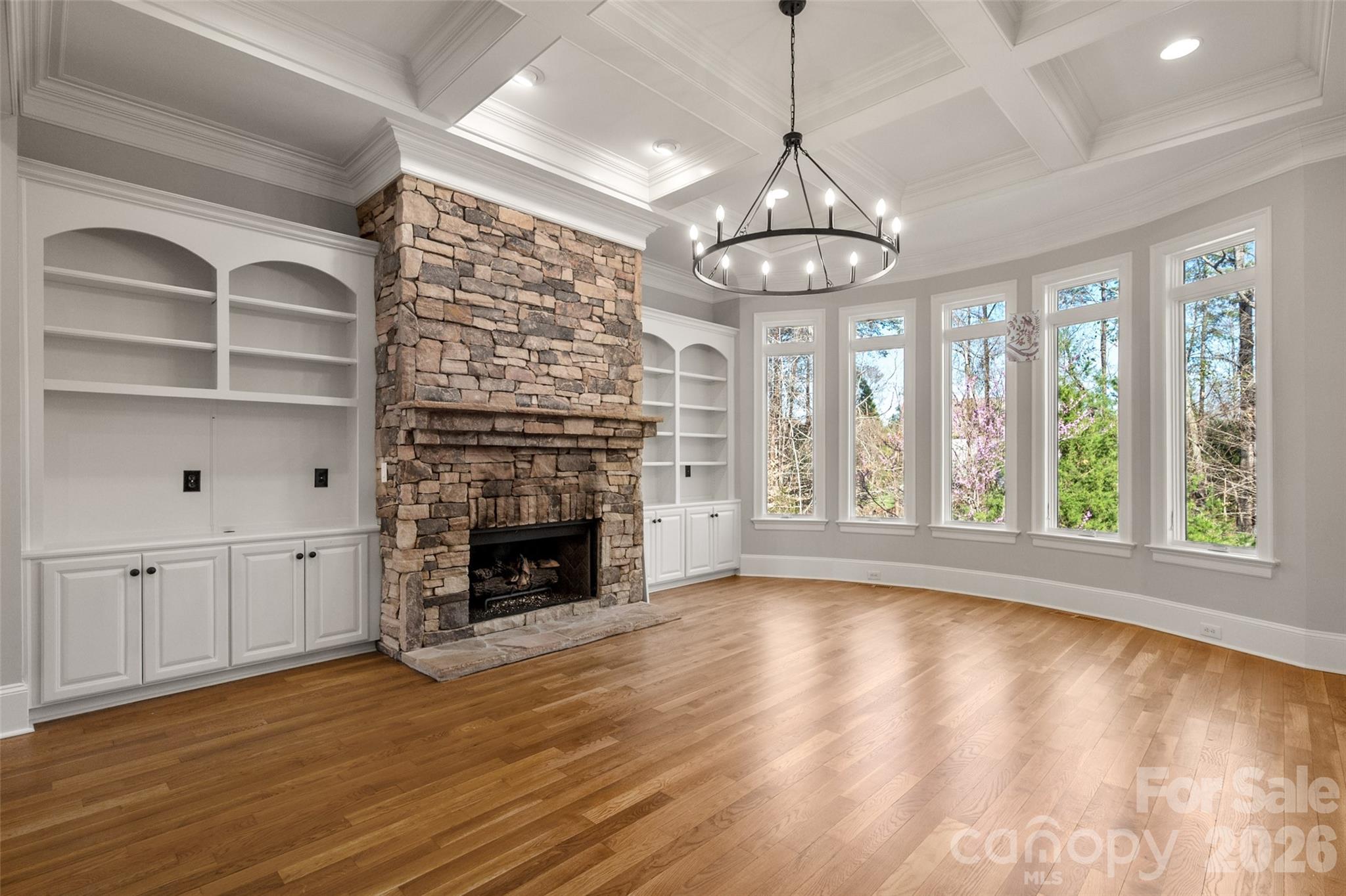 406 Belo Court Fort Mill, SC 29715 - Photo 16 of 46 a view of empty room with wooden floor and fireplace