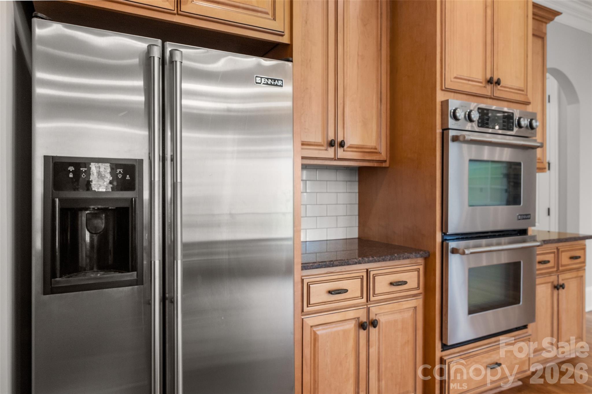 406 Belo Court Fort Mill, SC 29715 - Photo 23 of 46 a kitchen with stainless steel appliances granite countertop a refrigerator and a stove
