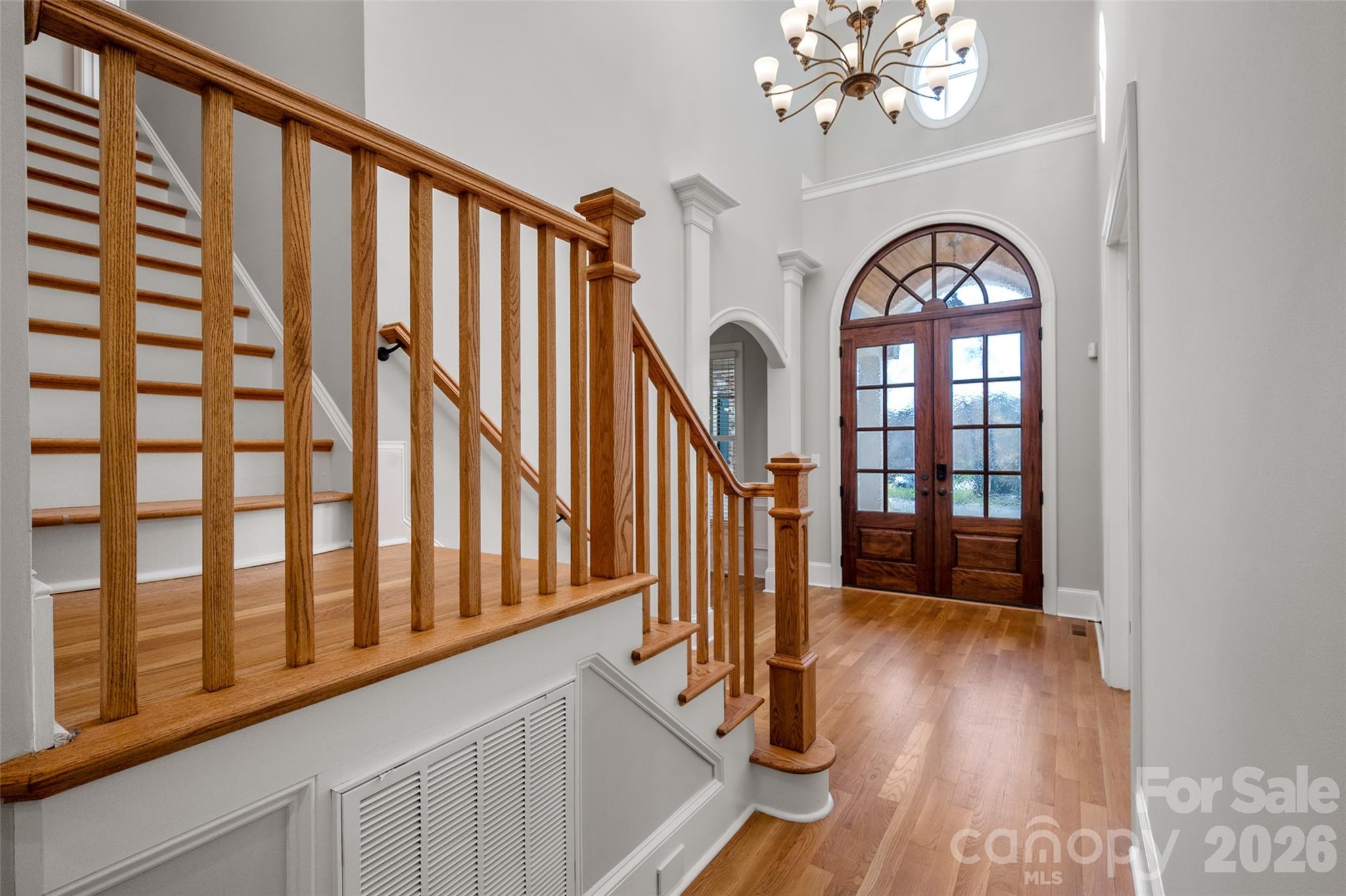406 Belo Court Fort Mill, SC 29715 - Photo 4 of 46 a view of entryway with wooden floor and stairs