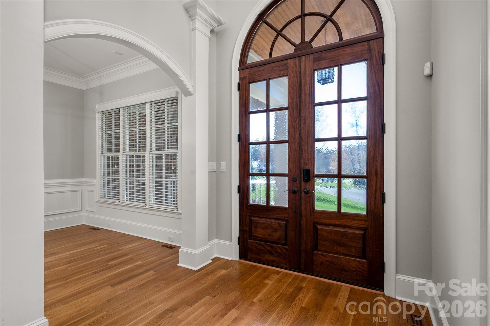 406 Belo Court Fort Mill, SC 29715 - Photo 5 of 46 an empty room with wooden floor and windows