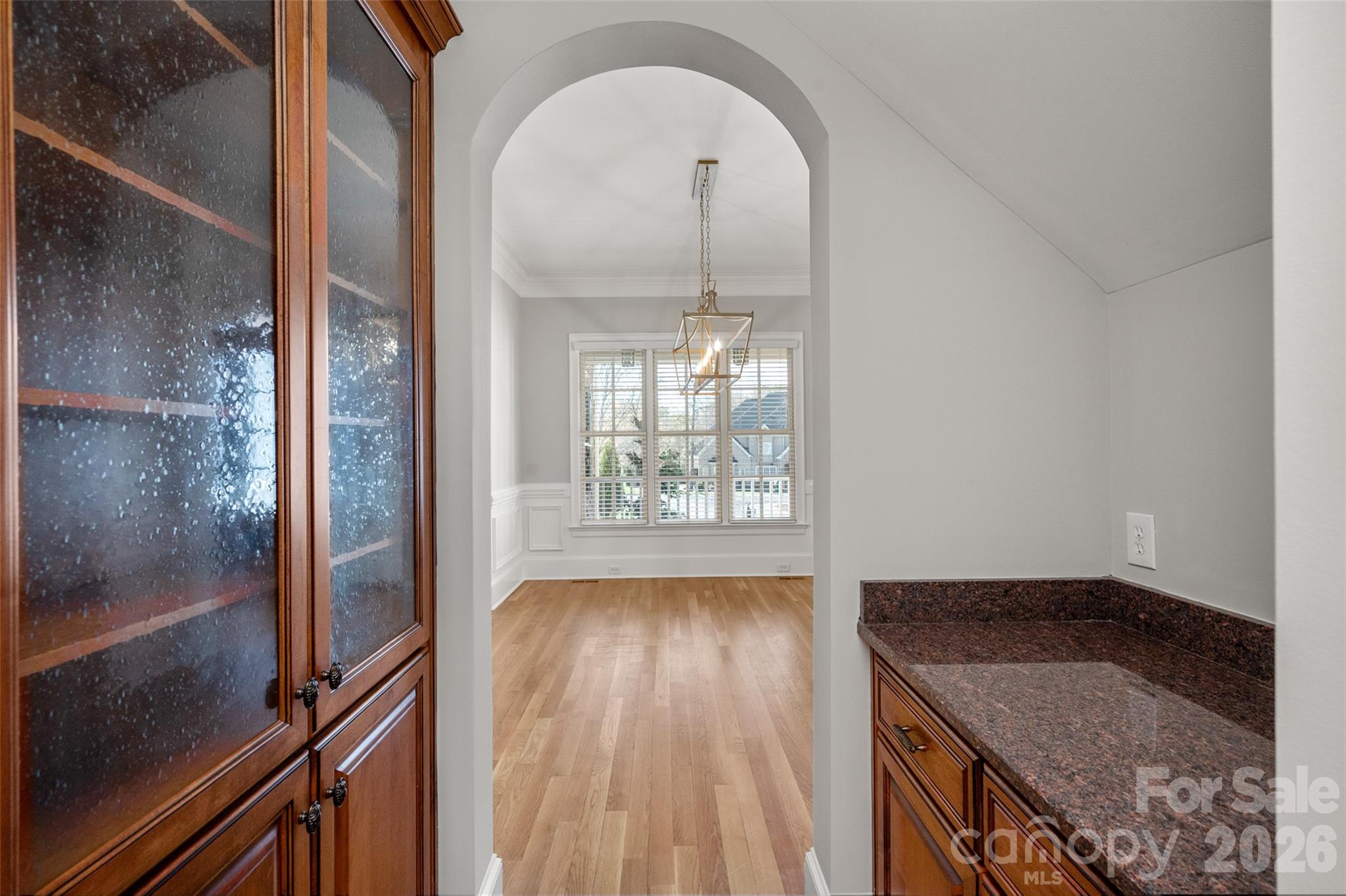 406 Belo Court Fort Mill, SC 29715 - Photo 10 of 46 a view of a hallway with wooden floor and a kitchen view