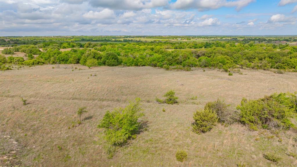 27 State Avenue Stephenville, TX 76401 - Photo 13 of 40 a view of a lake with a yard
