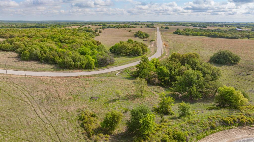 27 State Avenue Stephenville, TX 76401 - Photo 19 of 40 a view of a lake with a yard