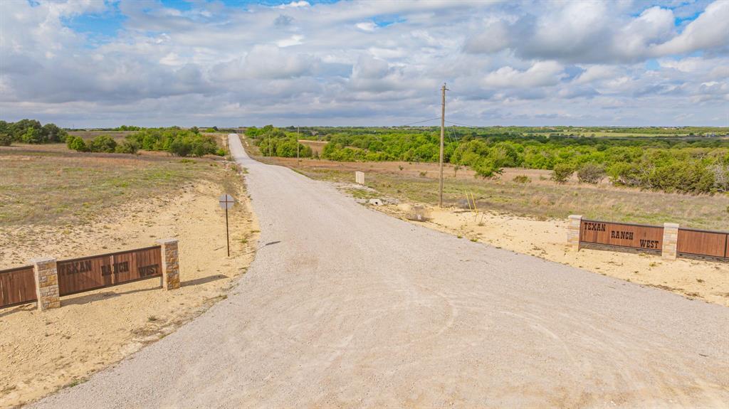 27 State Avenue Stephenville, TX 76401 - Photo 5 of 40 a view of a terrace with a lake