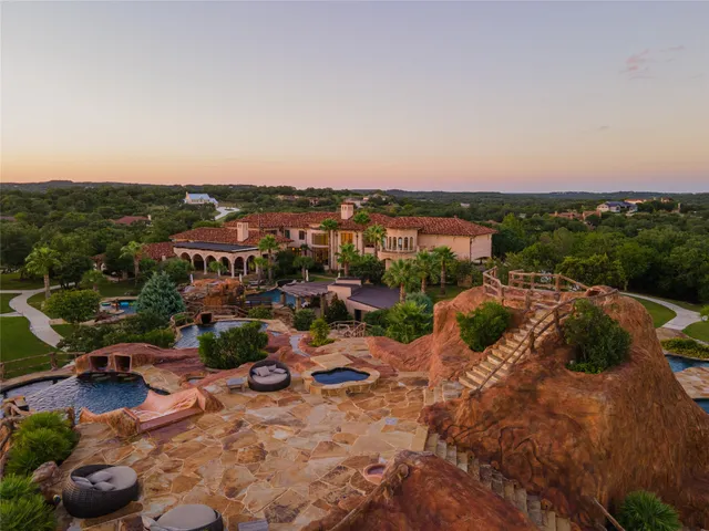 a view of a swimming pool with seating area